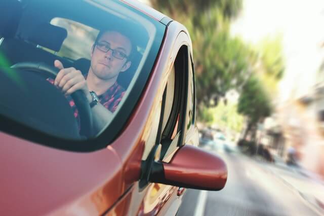 parallel parking and three point turns - Driver making a three point turn concept image.