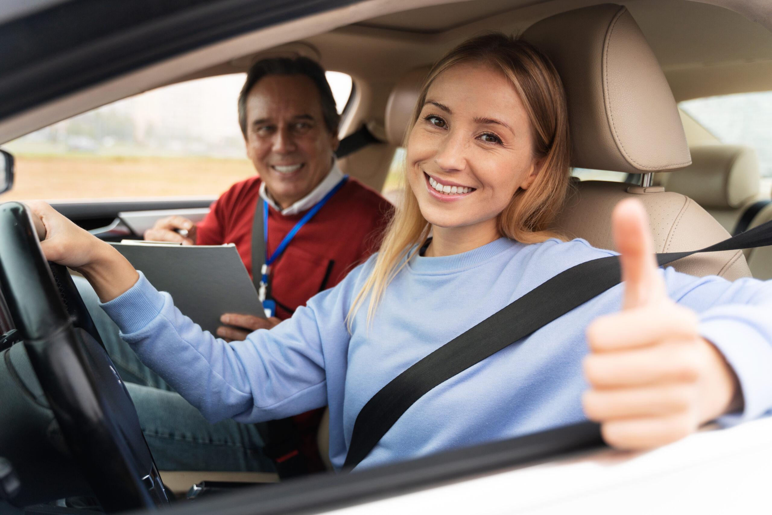 teen driver insurance - teen driving with driving instructor concept image.