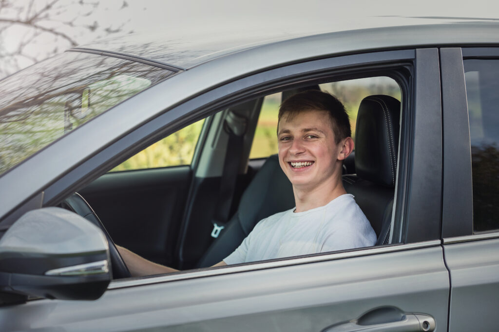 young driver behind the wheel. Driving preparation, concept image.